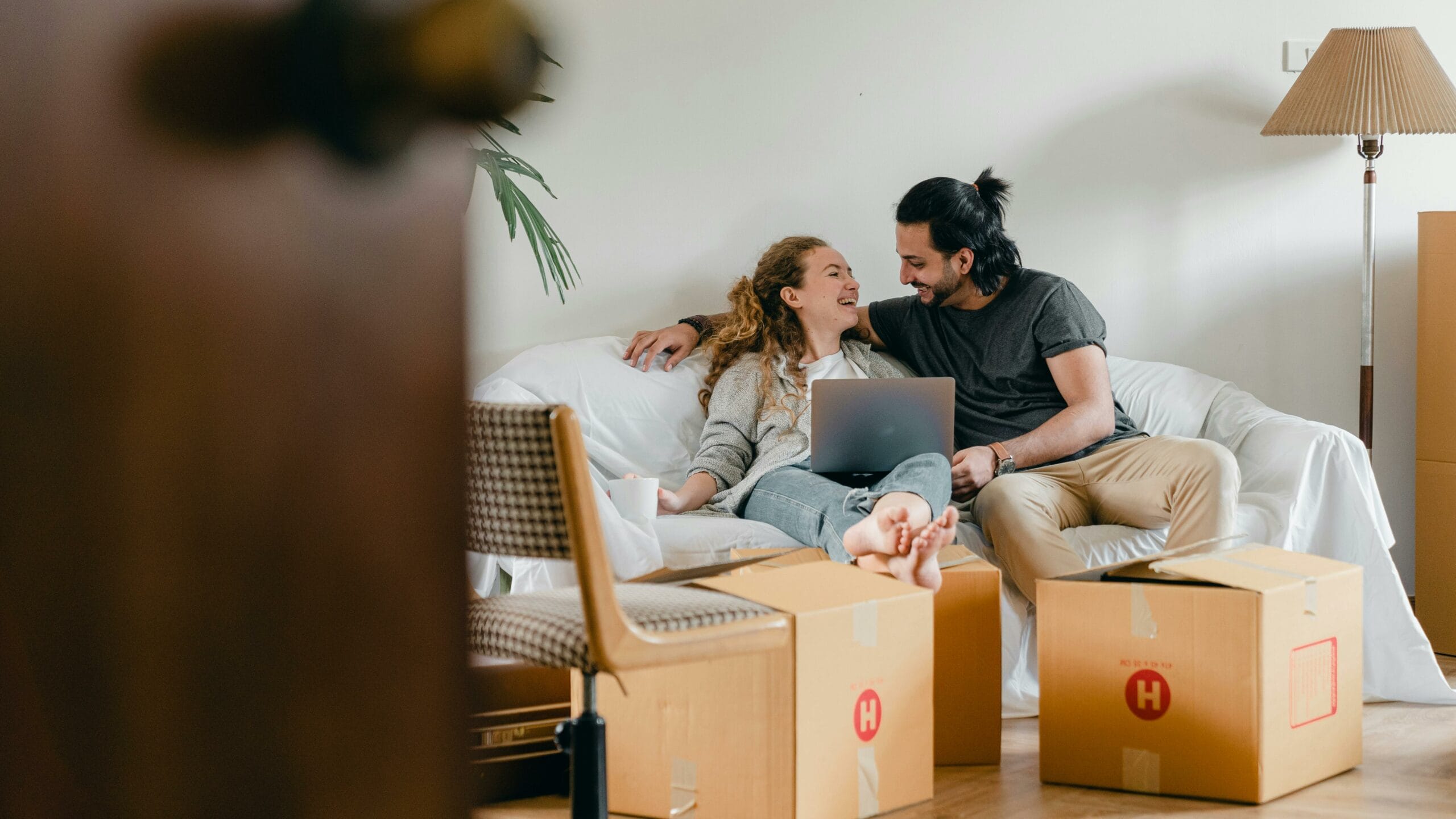 stock image - couple moving into house