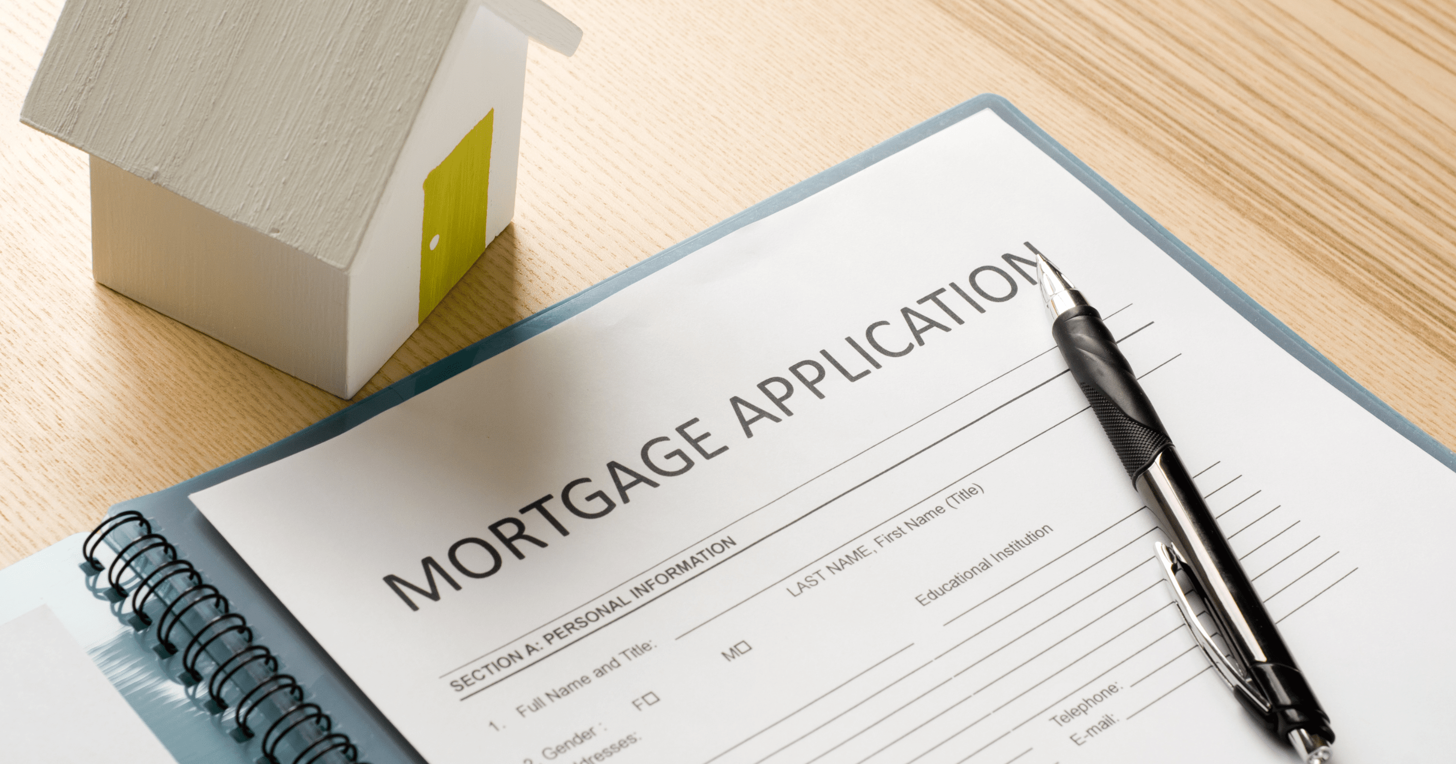 Stock image of a mortgage application - start your property search on Share to Buy!