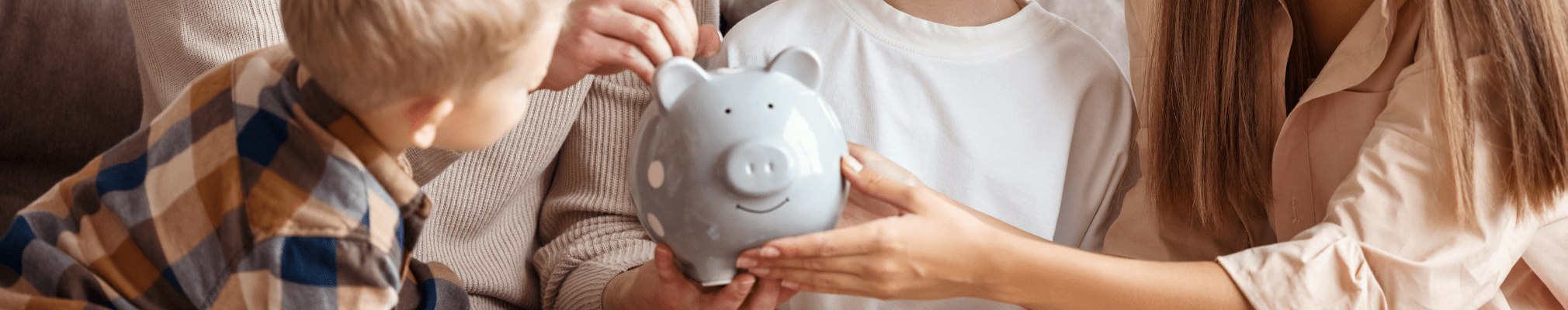 Family saving money in a piggy bank. Start your property search on Share to Buy!
