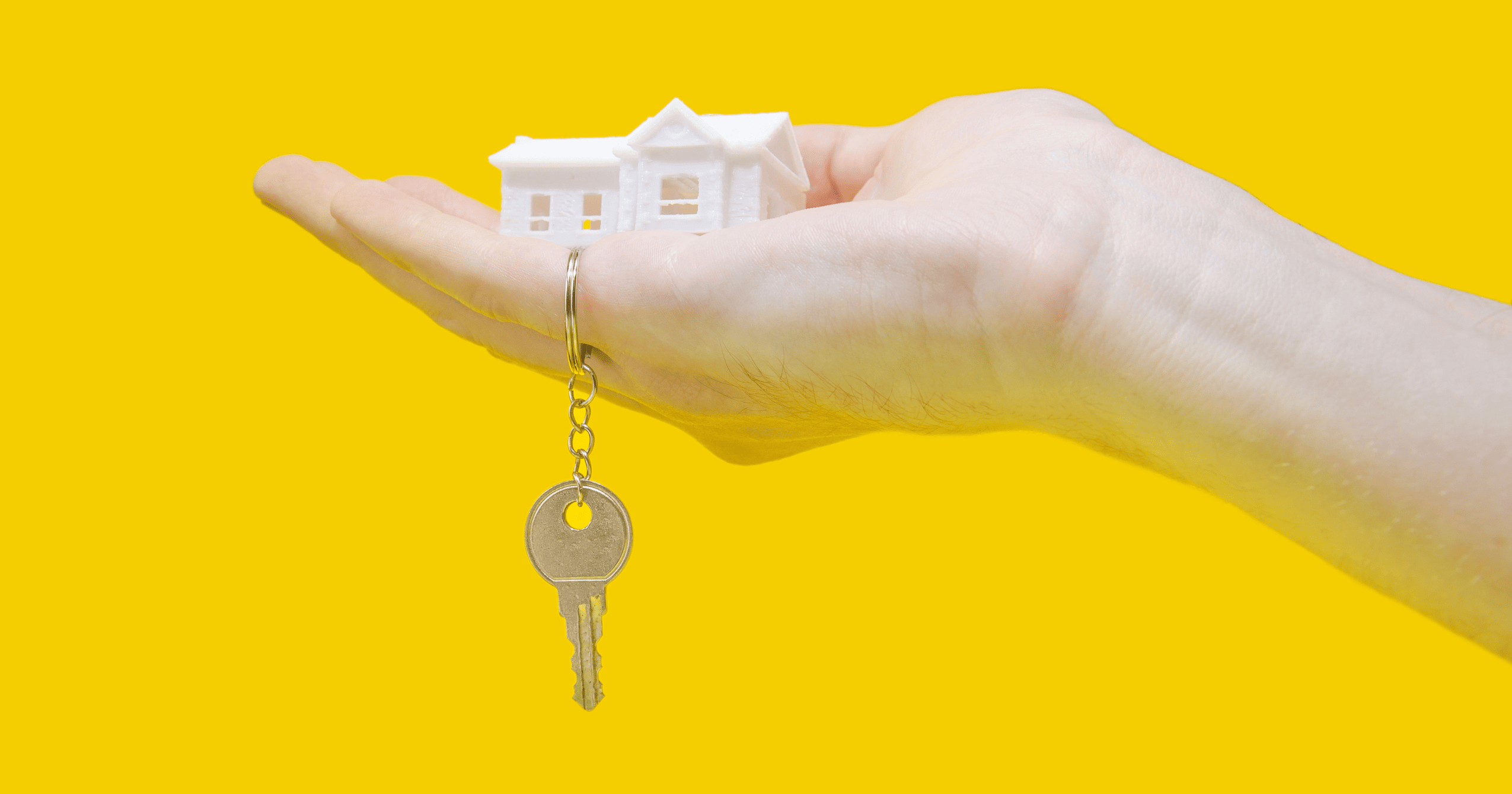 Stock image of a house model and key - find your new home on Share to Buy!