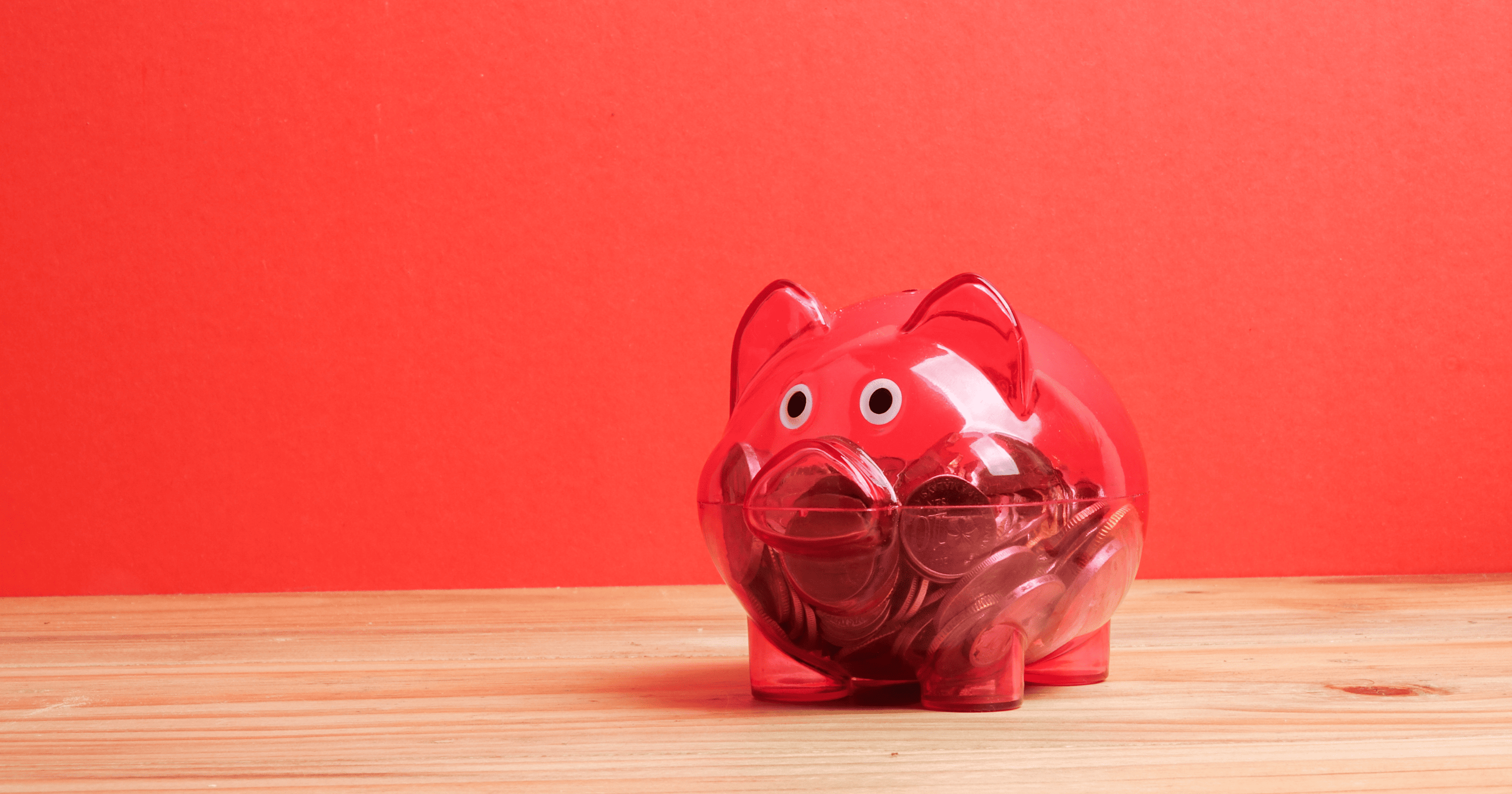 A stock image of a red piggy bank. Find a Shared Ownership mortgage with Censeo Financial - Share to Buy's broker partner!