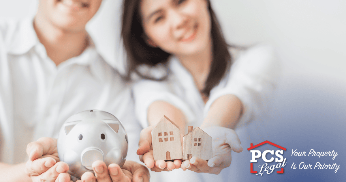 A stock image of a couple holding a piggy bank and a house model. Start your property search on Share to Buy!