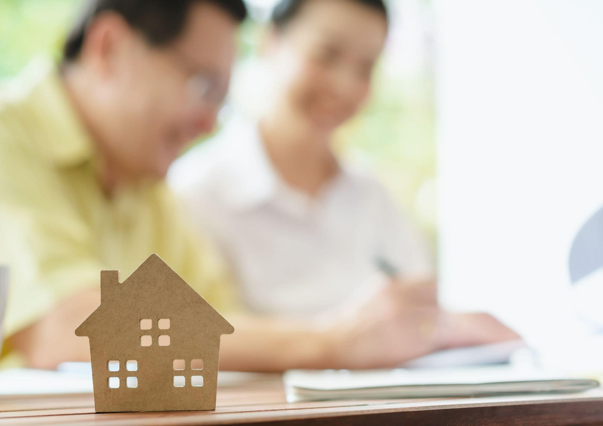 Stock image of a cardboard house - Start your property journey on Share to Buy!