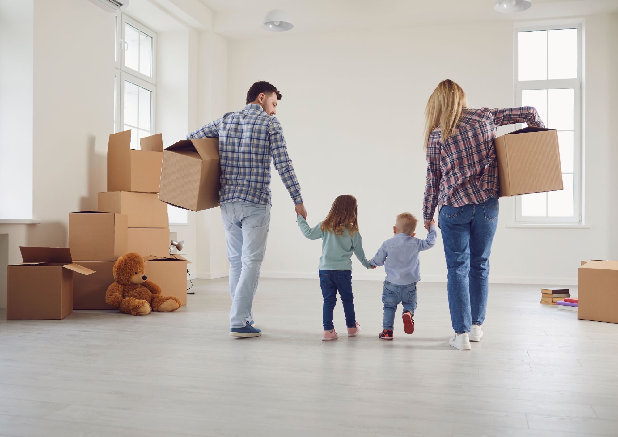 Stock Image of a family moving into a house - Start your property journey on Share to Buy!