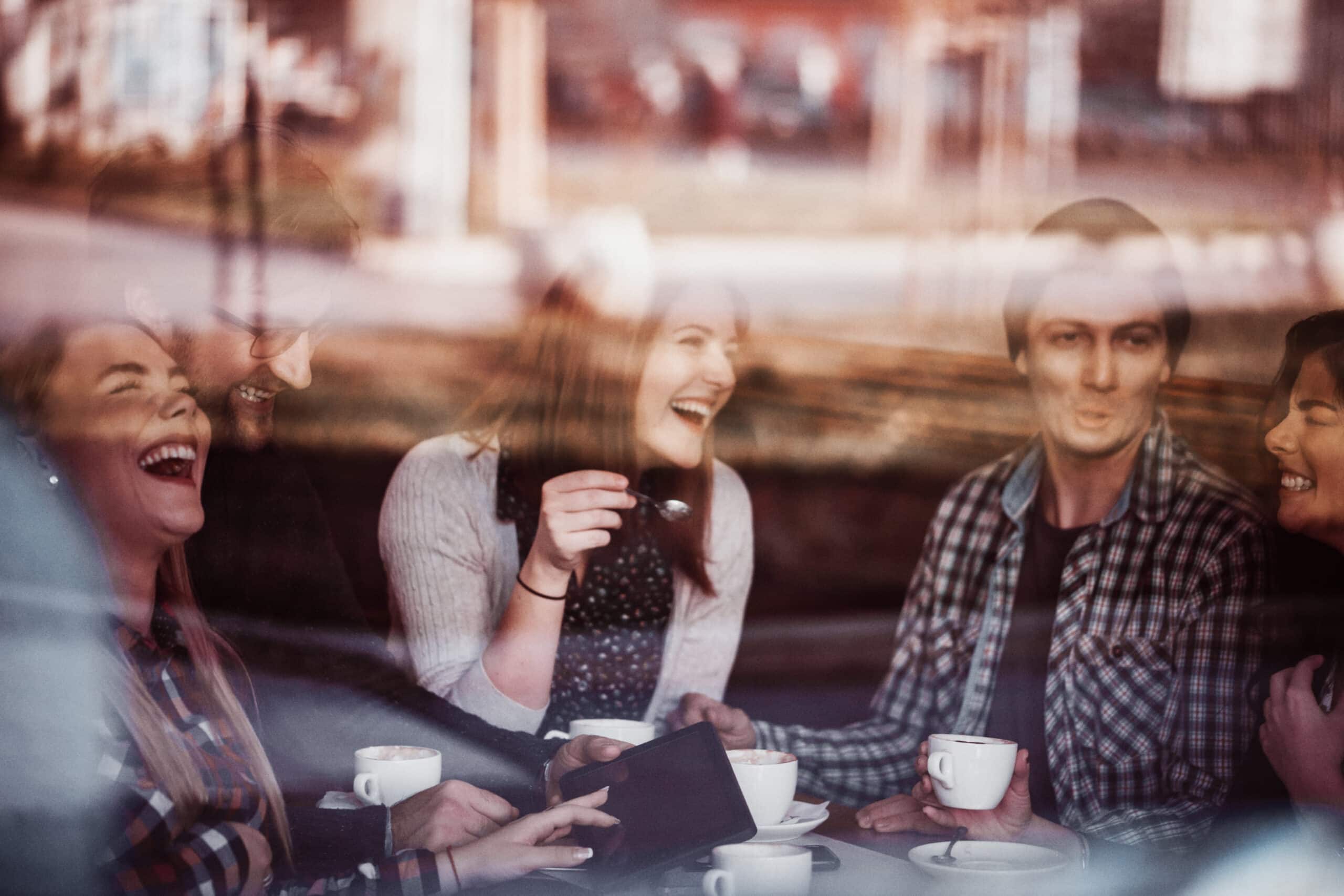 Stock image of friends at a coffee shop - Start your property journey on Share to Buy!