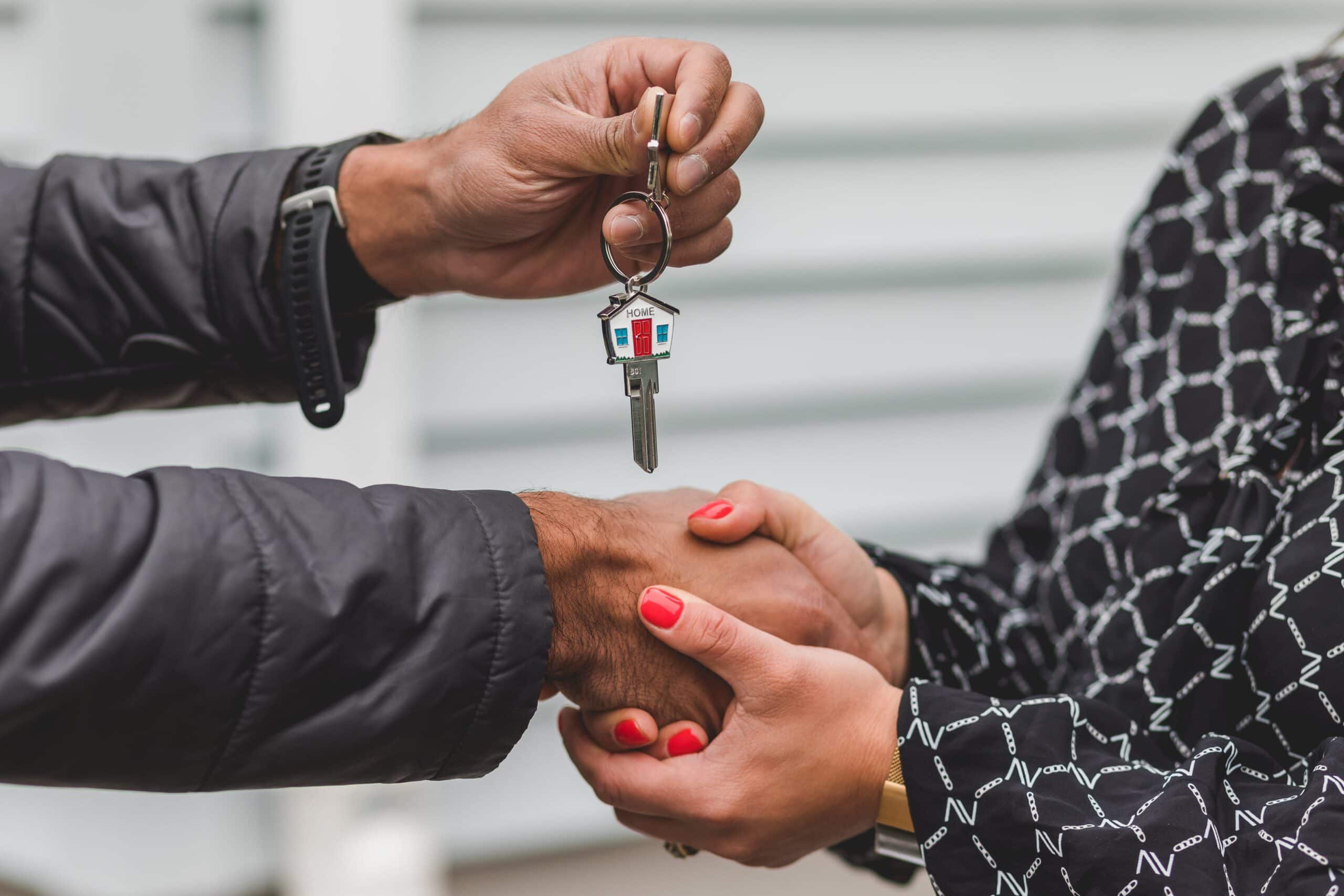 Stock image of getting keys to a house - Start your search on Share to Buy today!