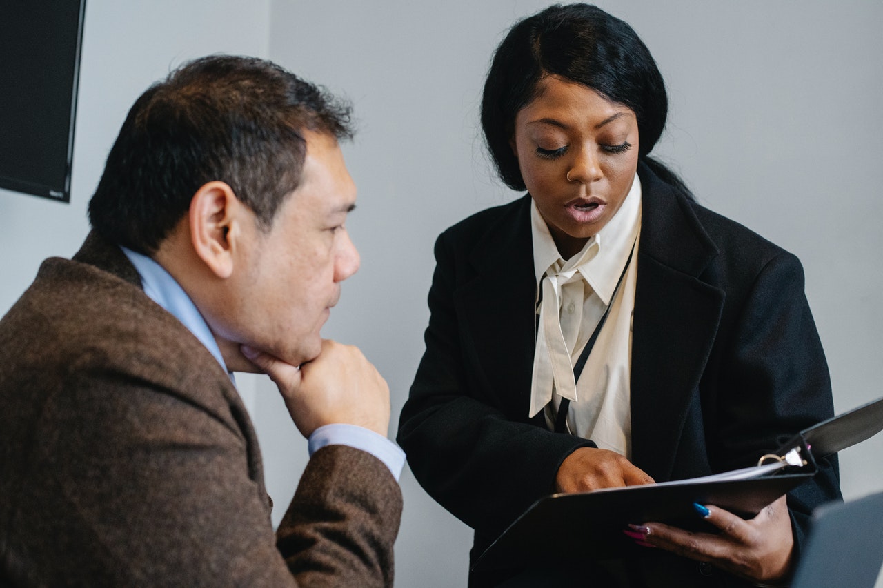 A stock image of a man and a solicitor speaking. Find a Shared Ownership mortgage with Censeo Financial - Share to Buy's broker partner!