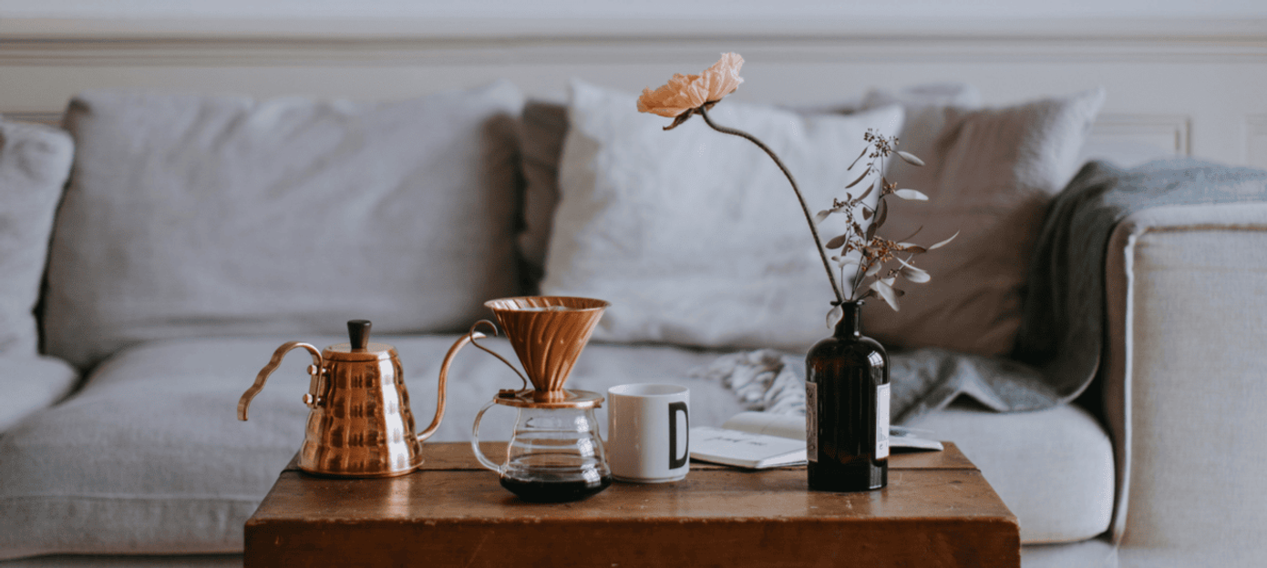 Grey sofa with a table and coffee