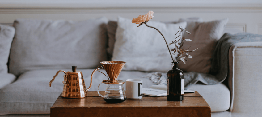 Grey sofa with a table and coffee