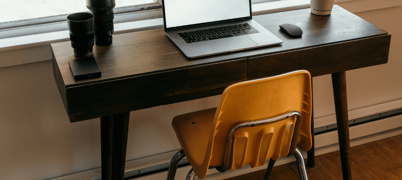 Home office set up with orange chair