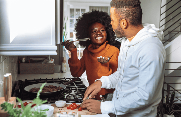 Couple cooking in kitchen