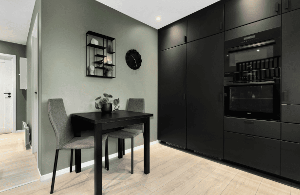 Open-plan kitchen diner with black units