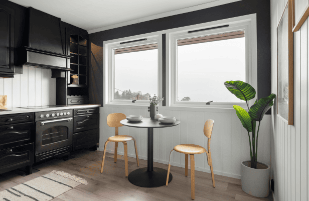 Open-plan kitchen diner with black units