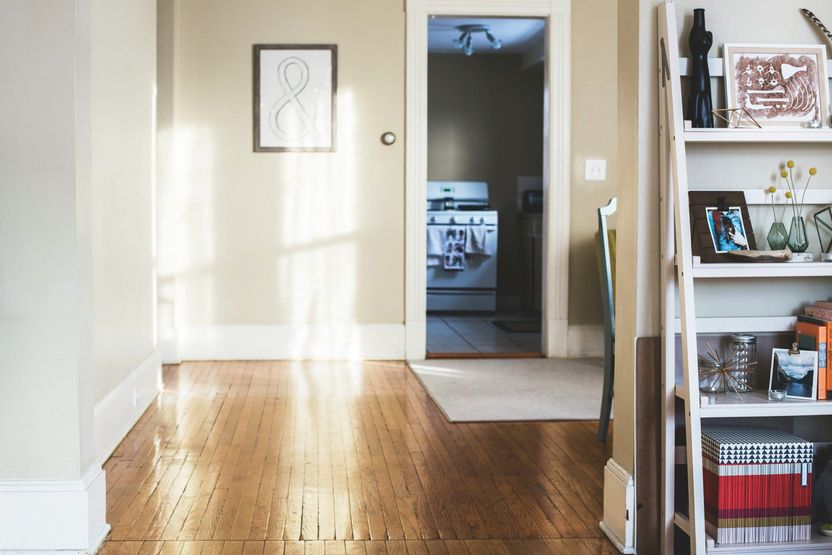 Light filled hallway with bookcase