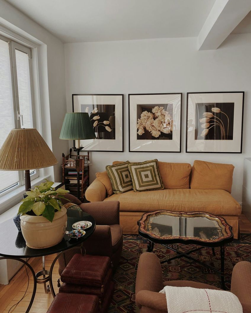 Living room set up with sofa, artwork and house plants