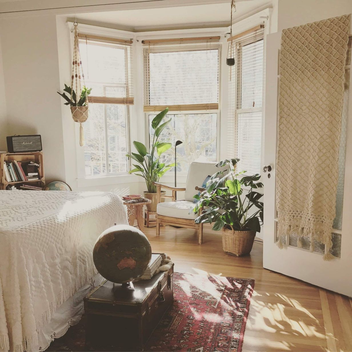 Light filled bedroom with houseplants