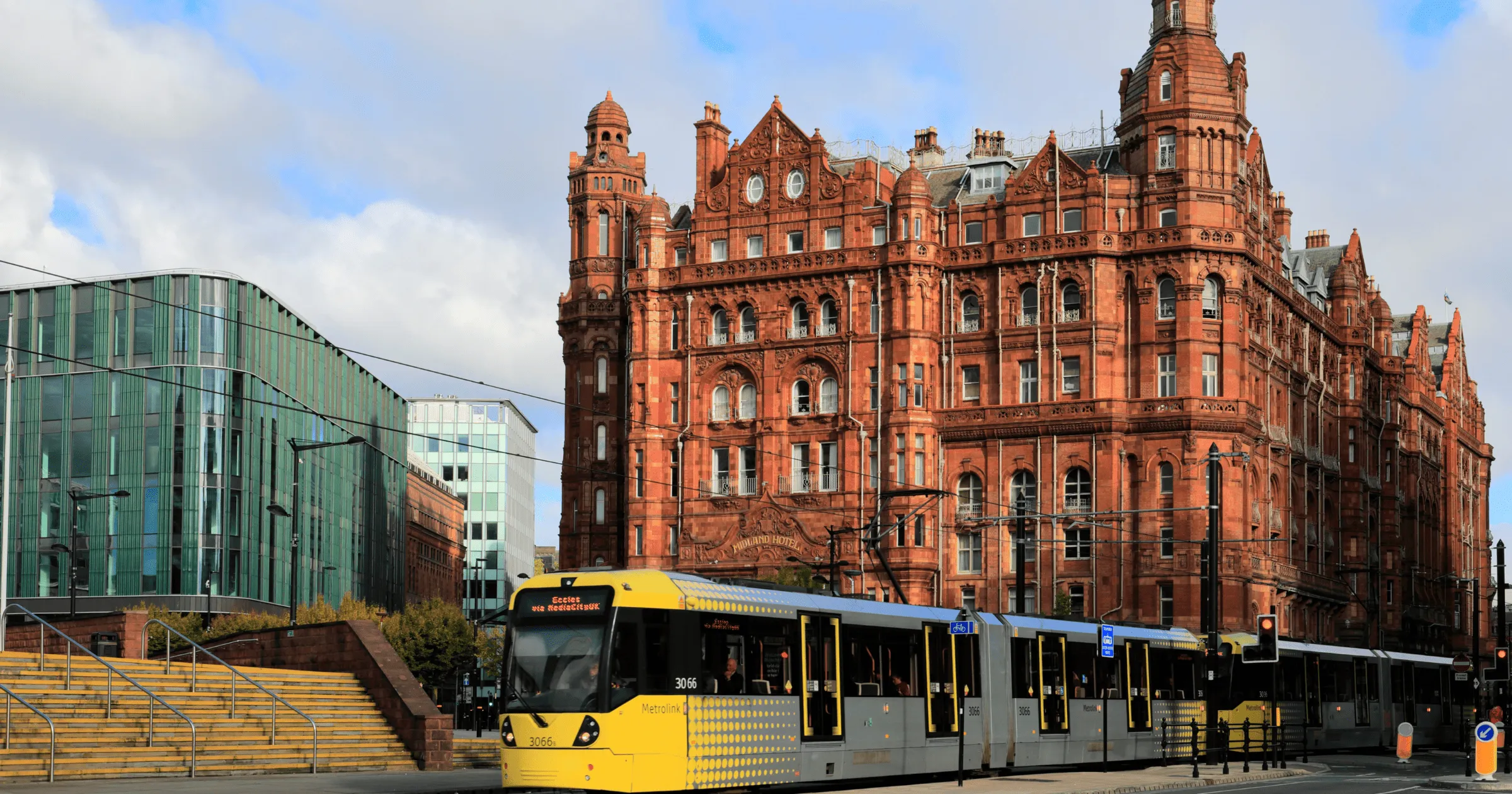 Central Manchester with historic building and tram