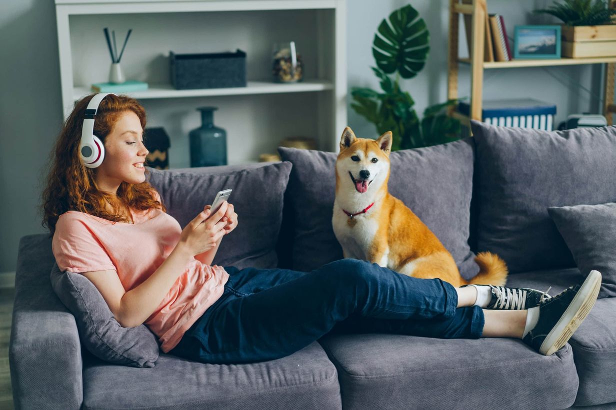 Women and dog on sofa