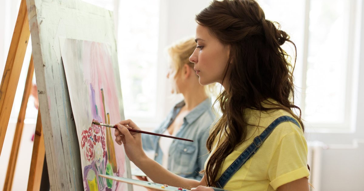 Stock image of a woman painting