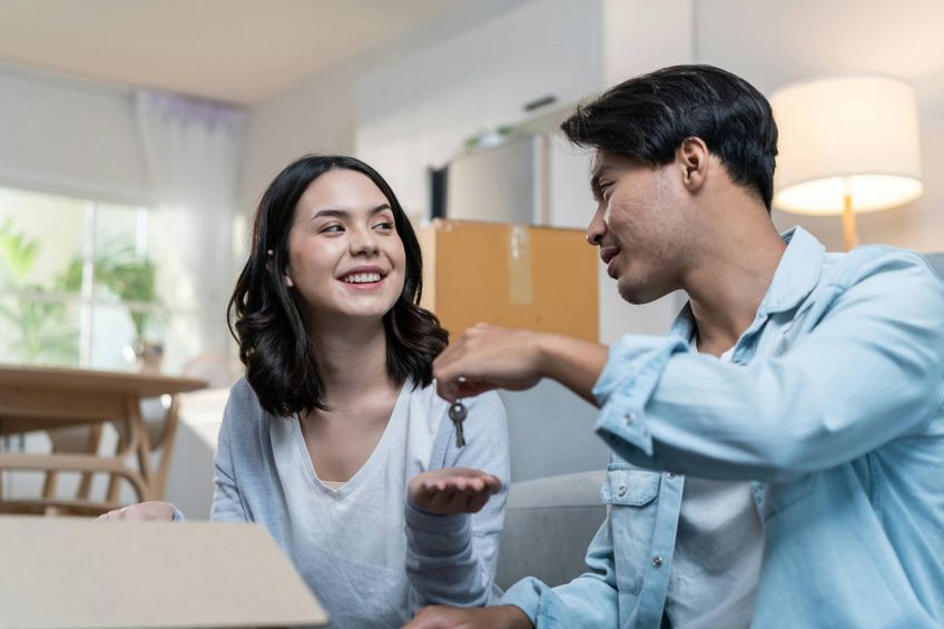 Couple buying and moving into their first home