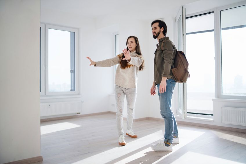 Couple attending a property viewing.