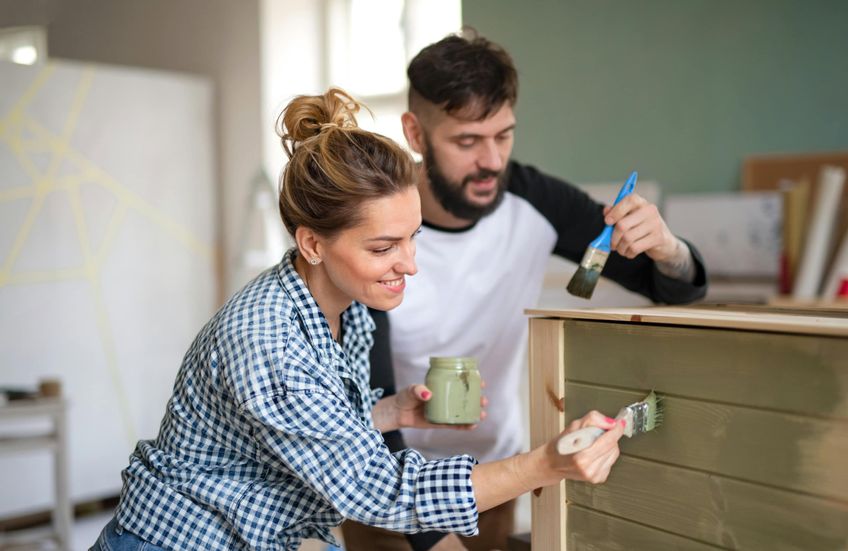 Couple decorating their Shared Ownership home.
