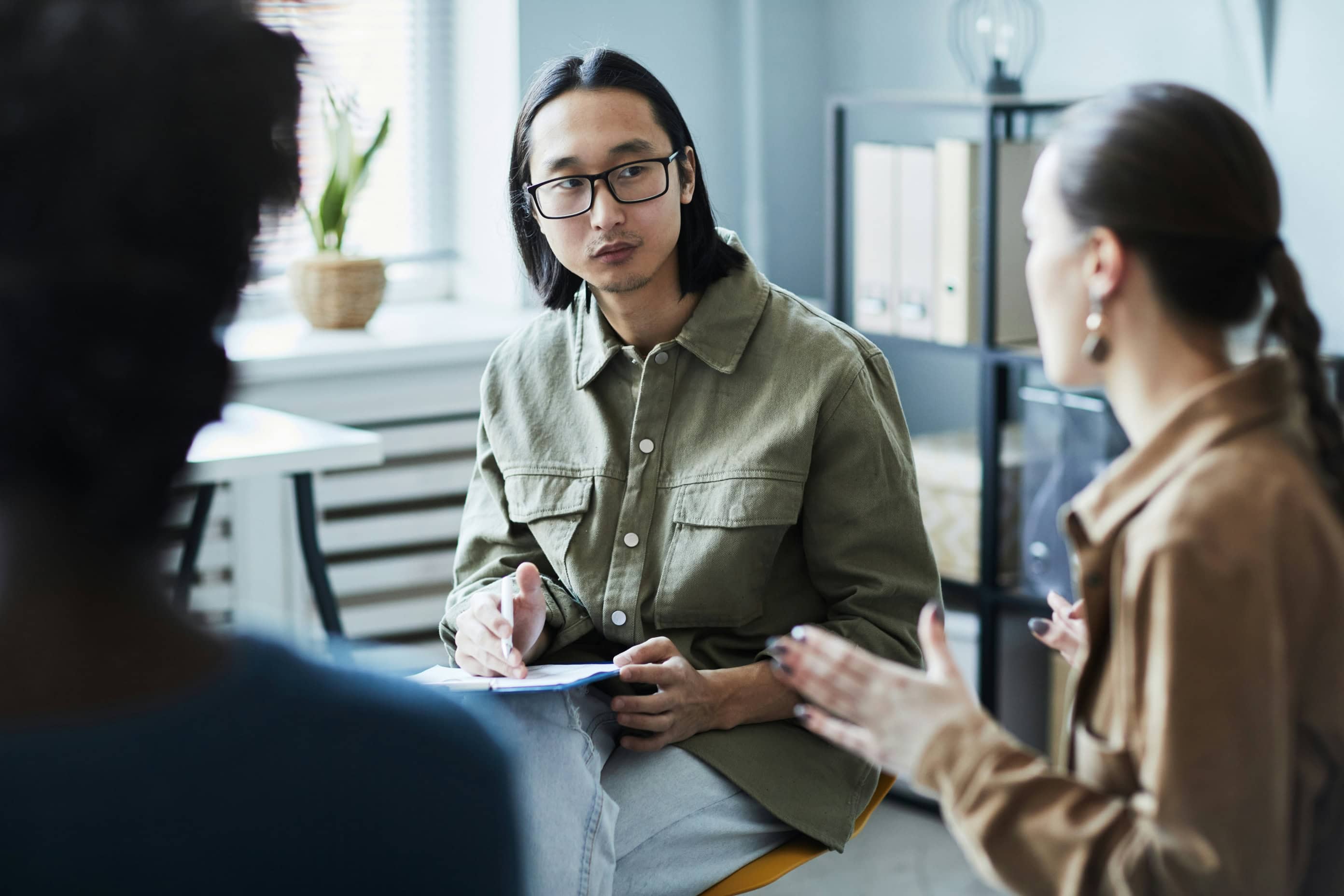 Couple speaking with a solicitor about purchasing a home