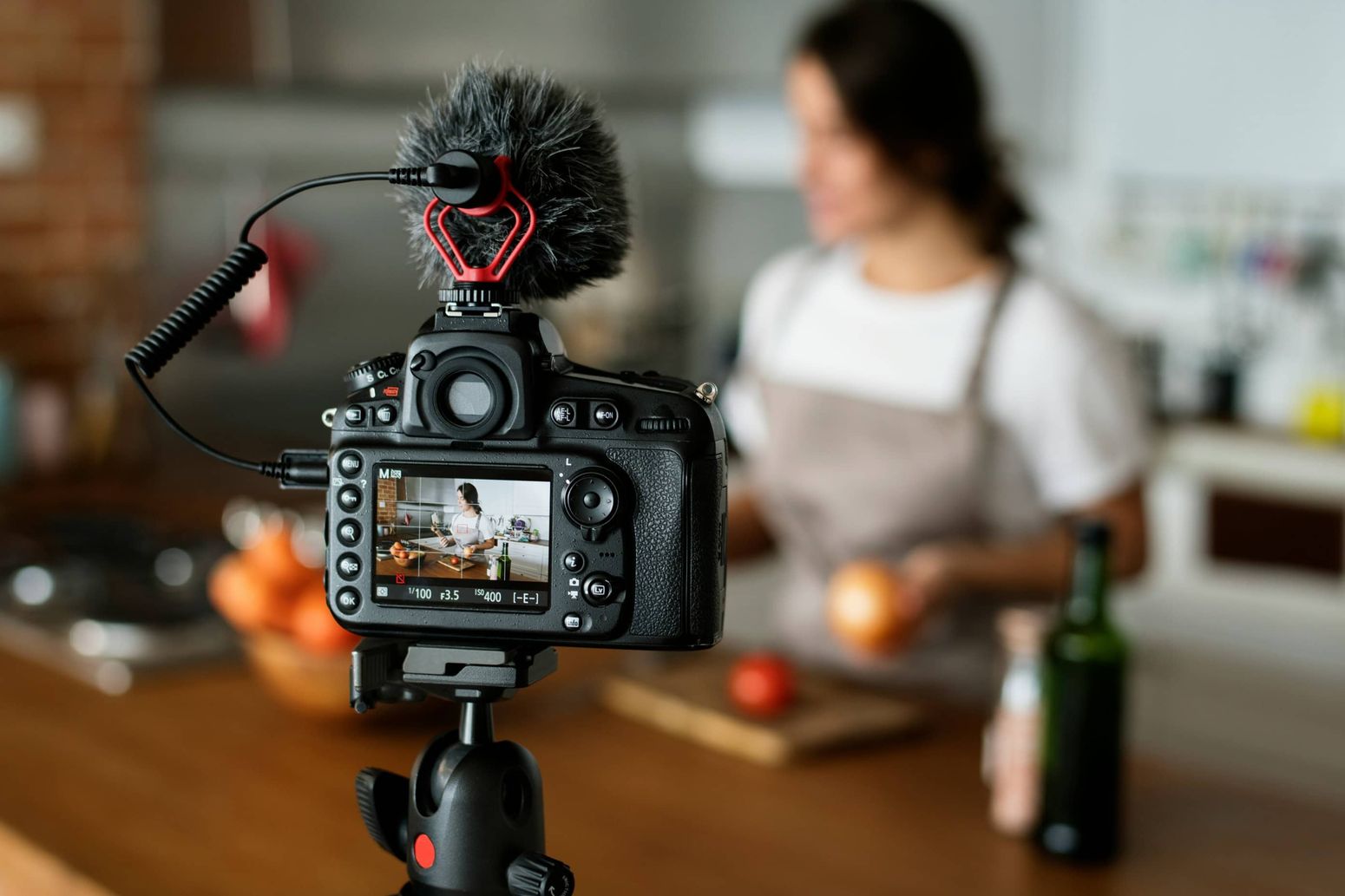 Woman cooking and creating content in her kitchen