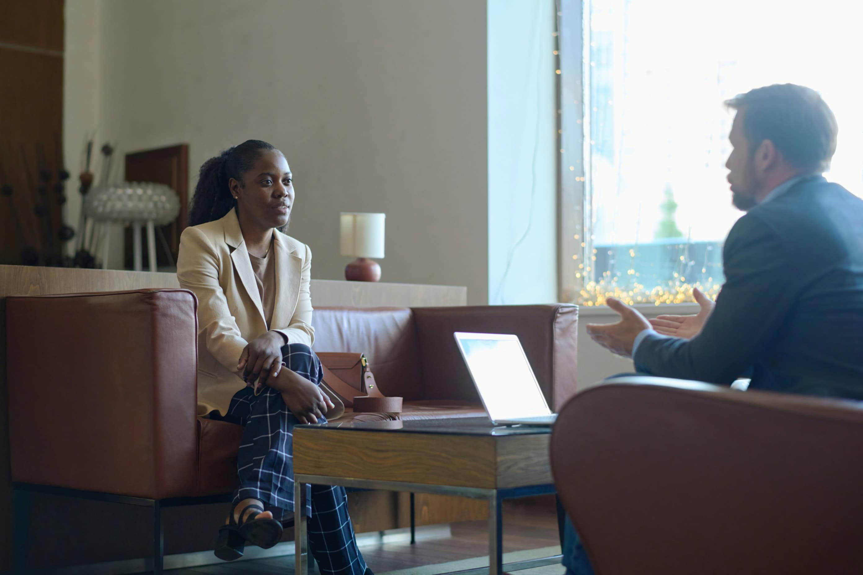 Woman negotiating with salesman on a Shared Ownership home