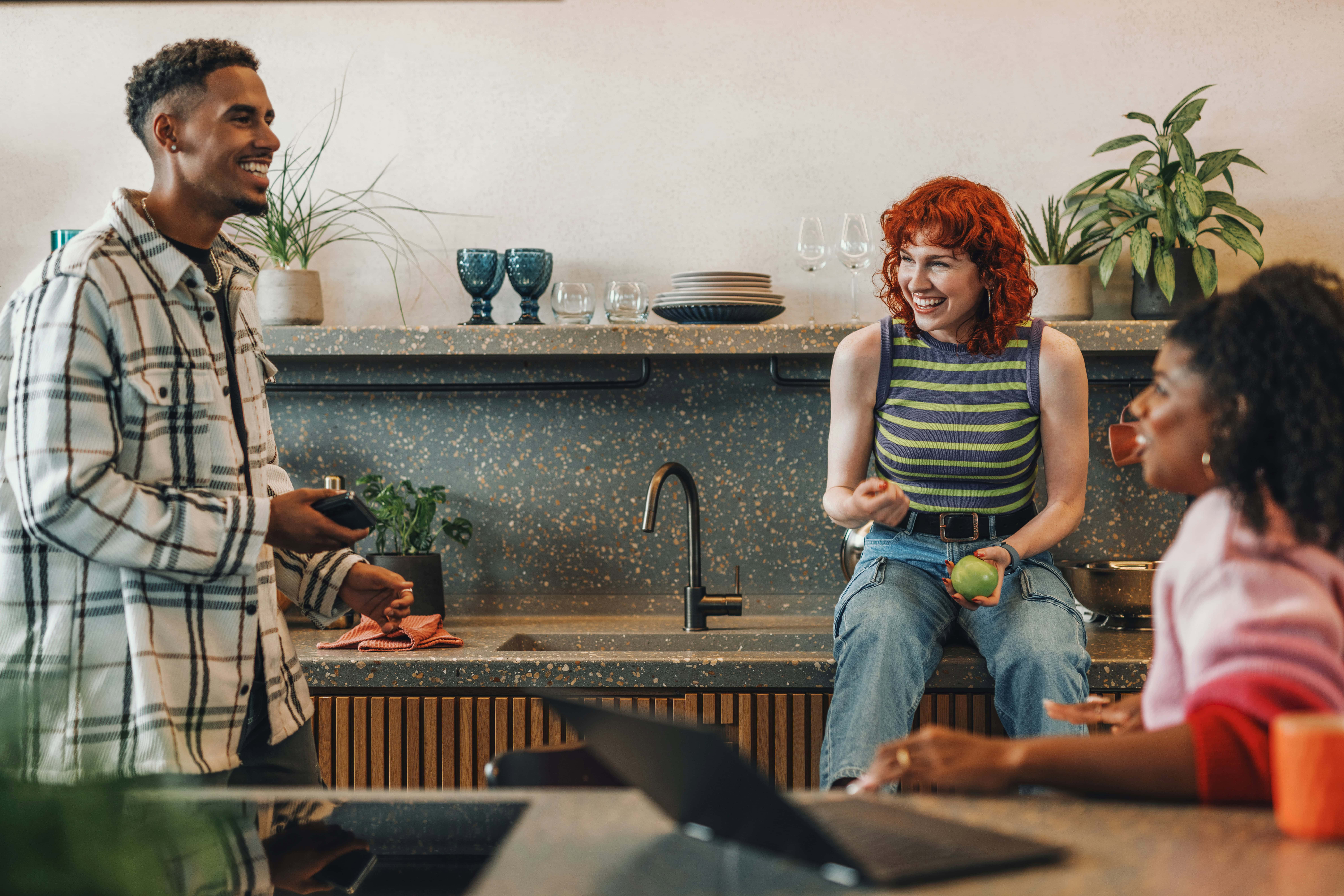 First time buyer in their new home with friends.